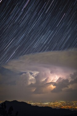 This thunderstorm over northern Colorado produced alot of in-cloud lightning with clear sky above. My immediate thought would combine the best lightning with star trails. This stacked composite is the result of that vision.